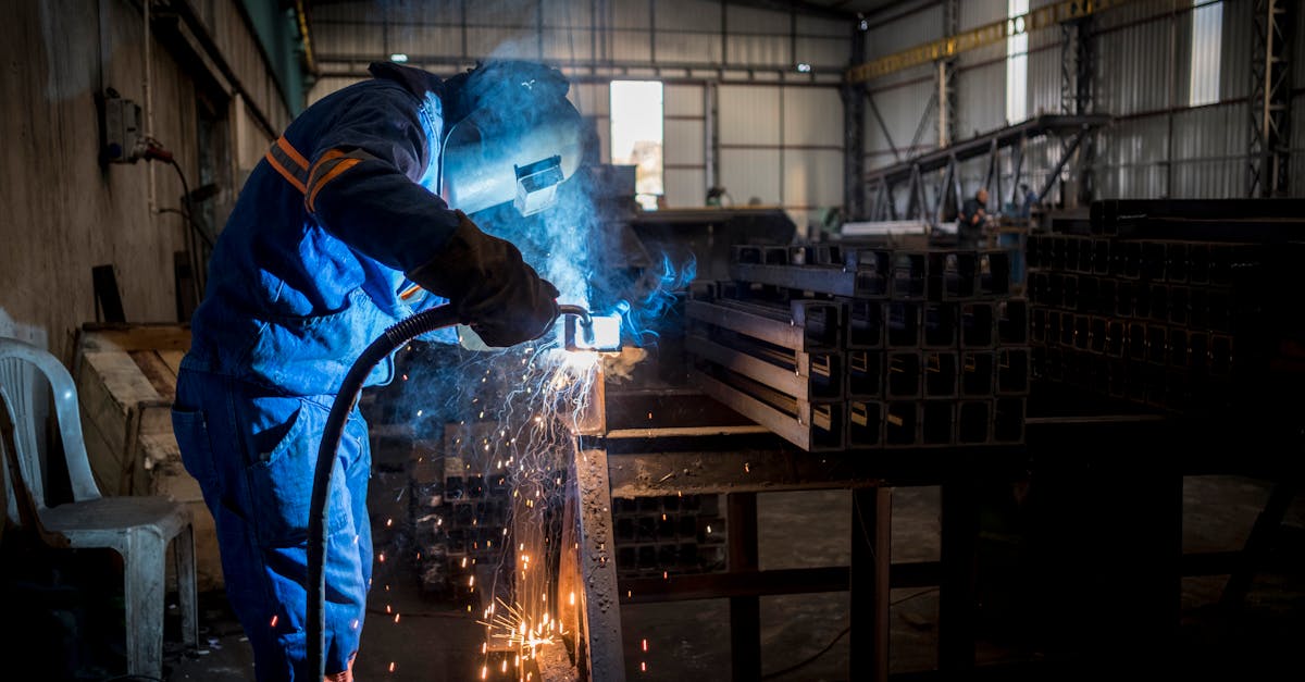Home A welder at work inside a manufacturing facility in Adana, Türkiye. Sparks fly during the process.